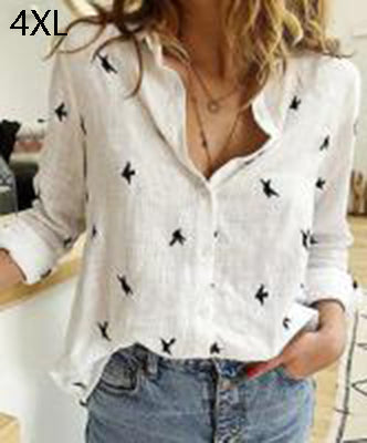 White blouse with black patterns worn by a person, with text '5XL' in the corner.