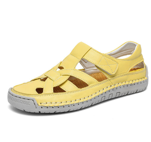 Yellow sandal with gray sole on a white background
