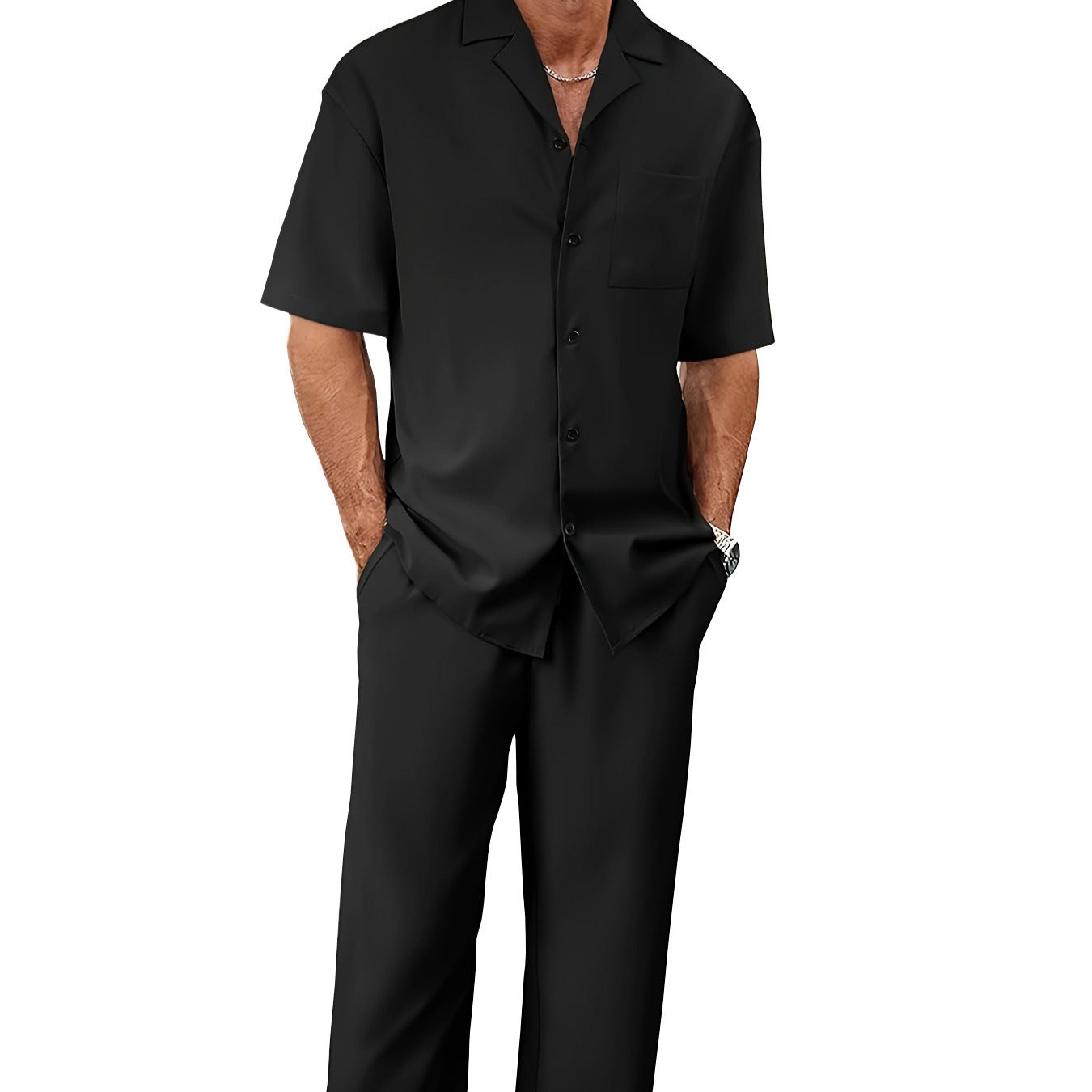 Person wearing a black short-sleeve shirt and black pants on a white background