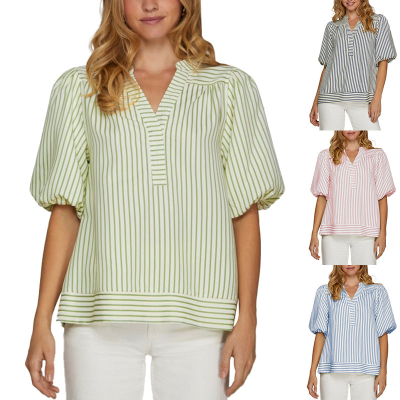 Woman wearing a green and white striped blouse with four different color options displayed.