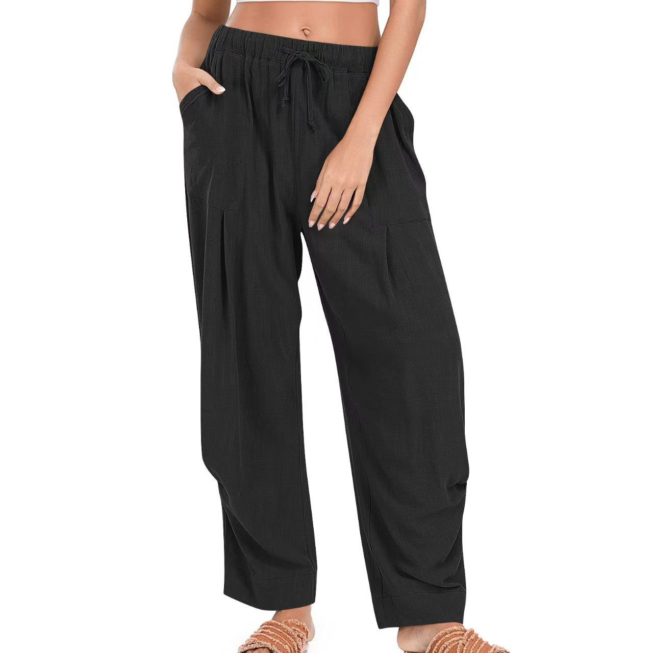 Black wide-leg pants worn by a person on a white background