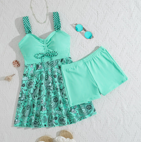 Mint green dress with paisley pattern and matching shorts on a textured white background