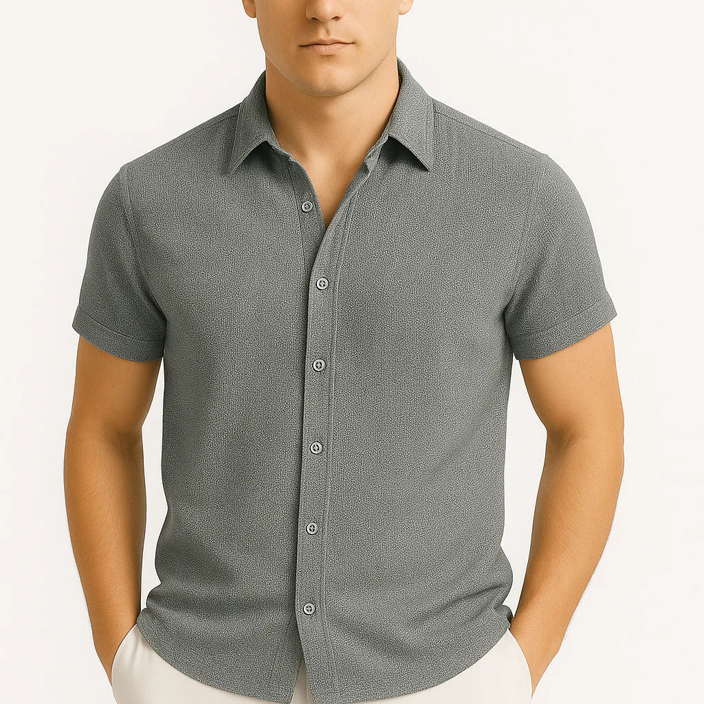 Man wearing a gray short-sleeve button-up shirt on a white background