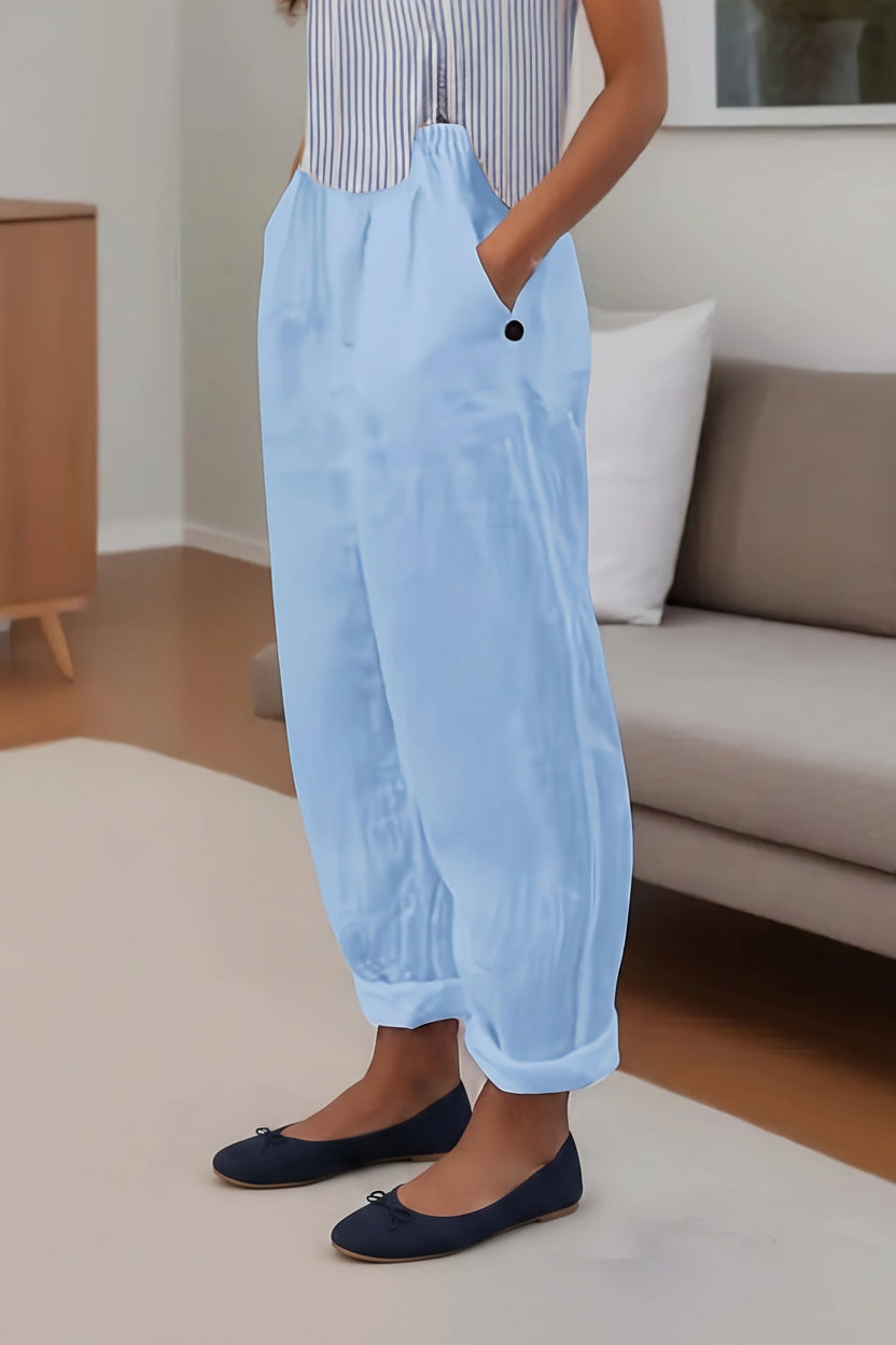 Person wearing light blue pants in a living room setting