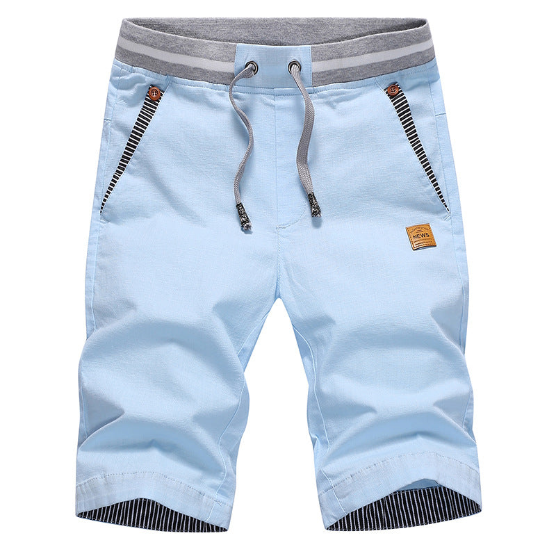 Light blue shorts with gray waistband and striped details on a white background