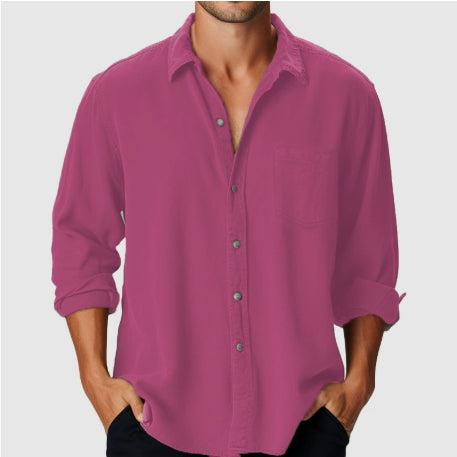 Magenta button-up shirt worn by a person on a white background