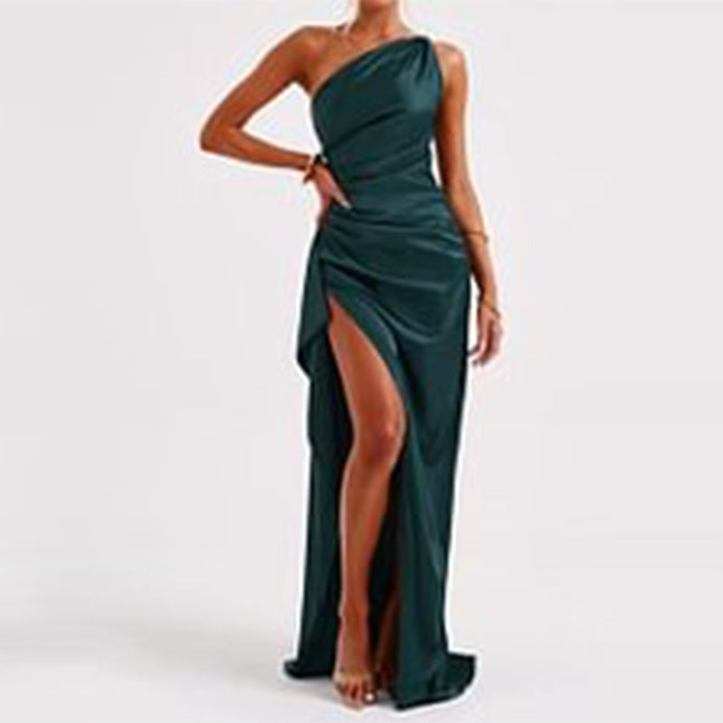 Green one-shoulder dress with a high slit on a white background