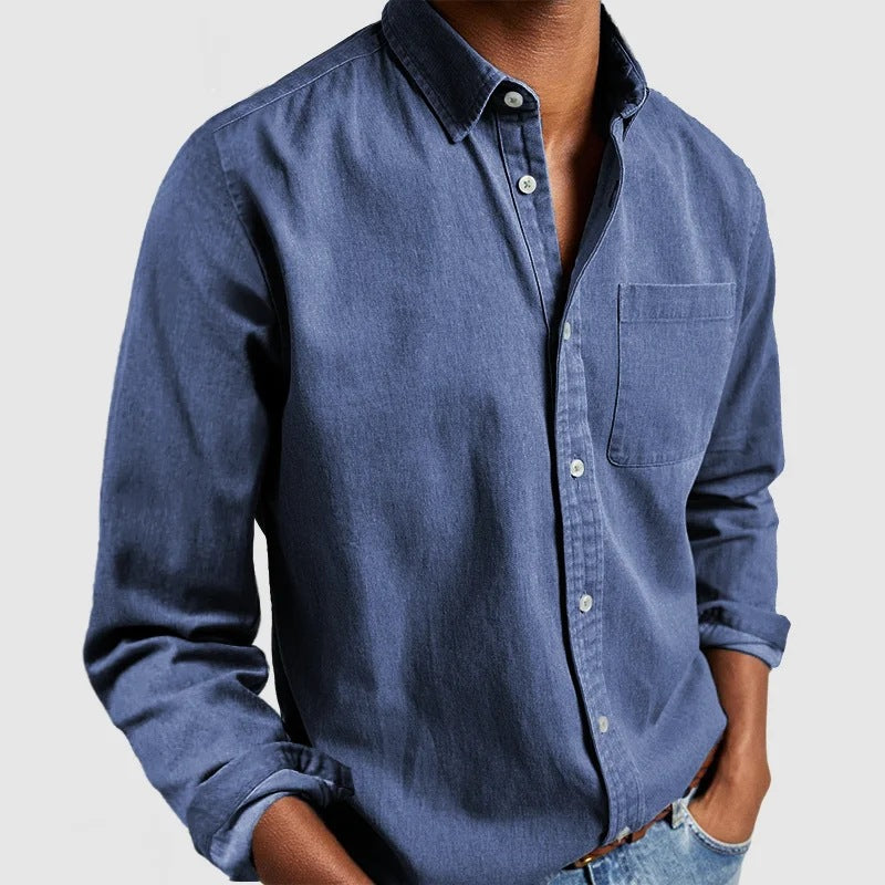 Blue button-up shirt worn by a person on a light gray background