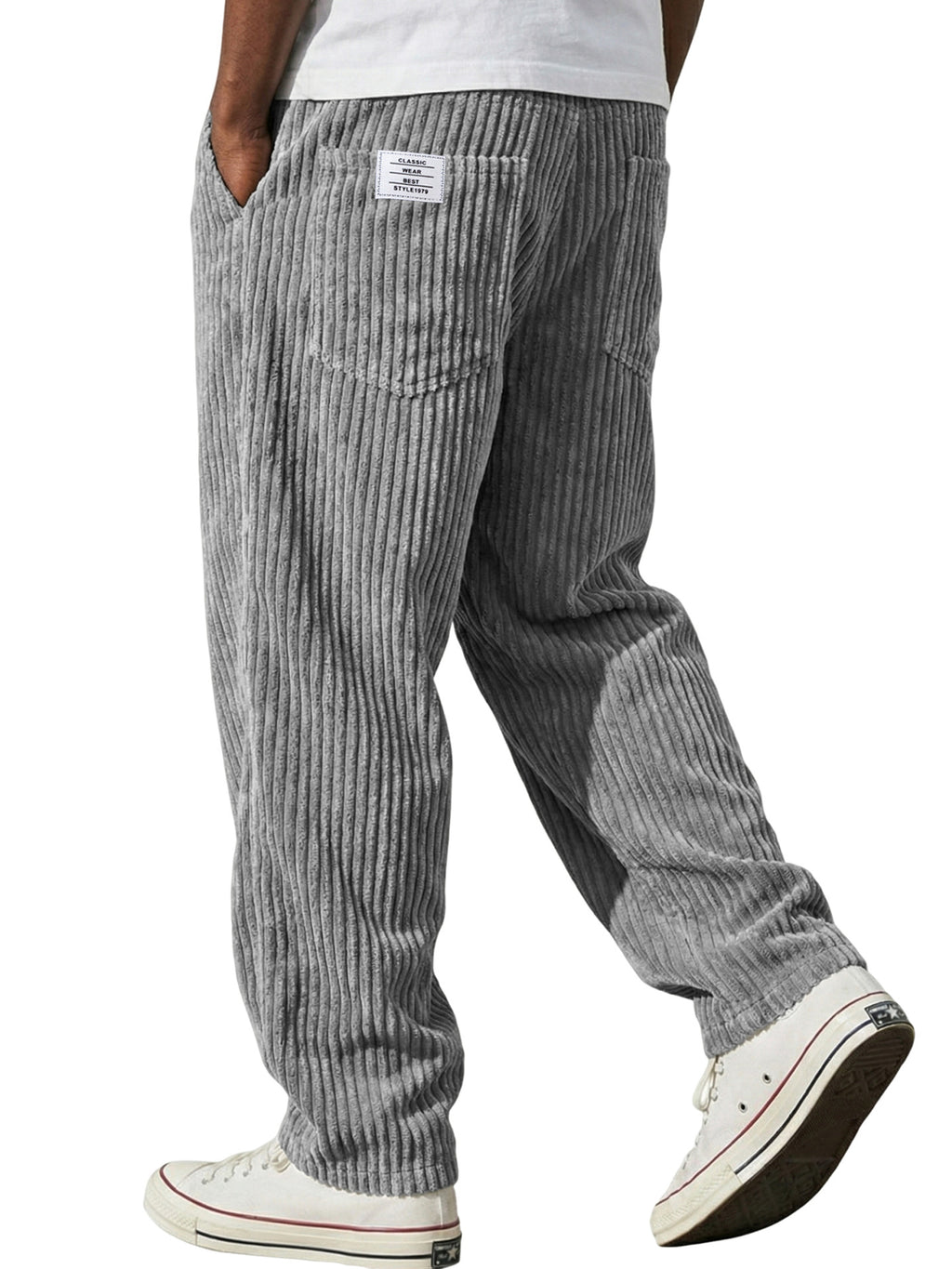 Gray striped pants worn by a person on a white background