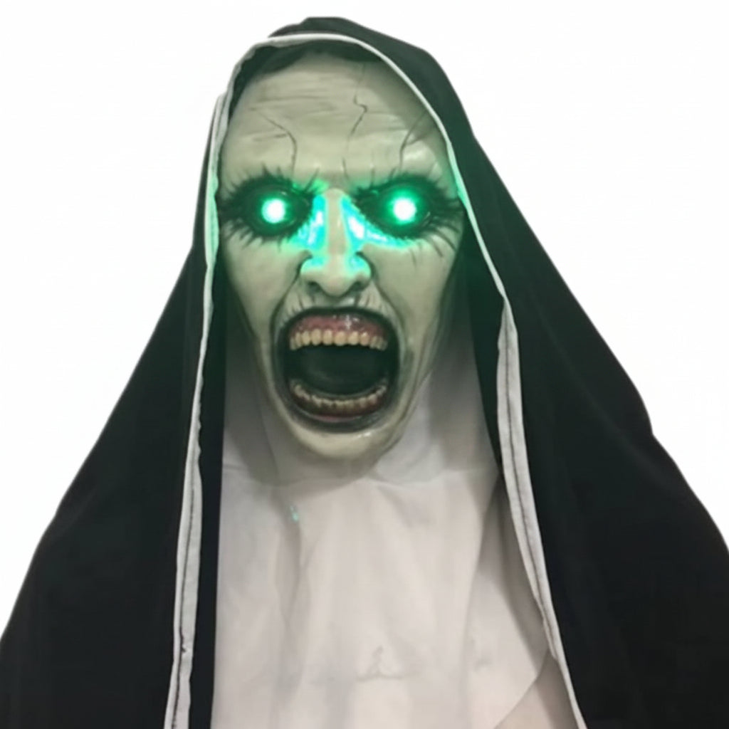 A scary nun Halloween mask with glowing green LED eyes, a screaming expression, and a black and white habit, shown against a white background with a Chinese watermark.