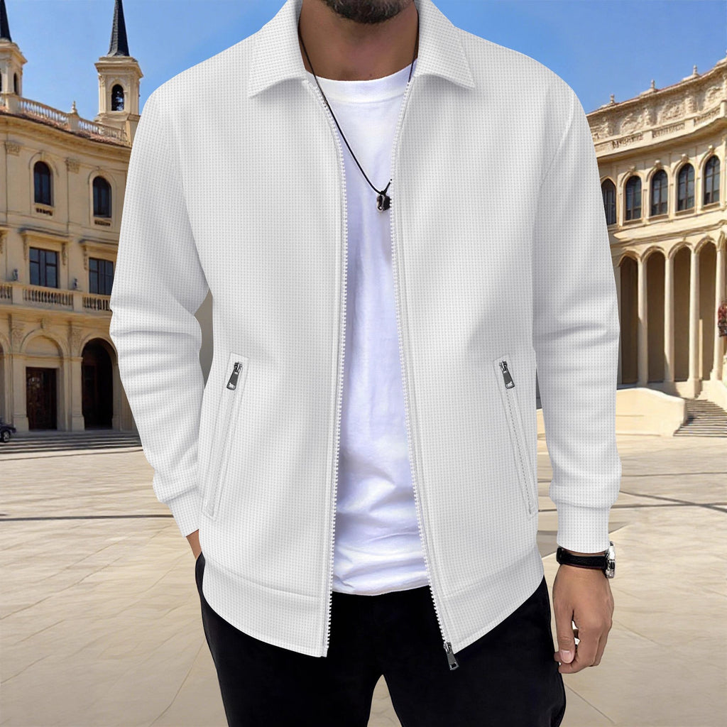 Person wearing a white jacket in front of a historical building