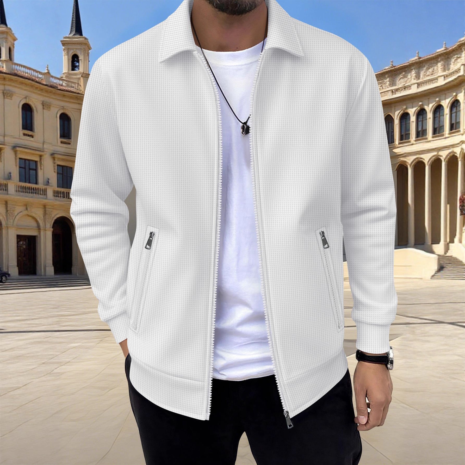 Person wearing a white jacket in front of a historical building