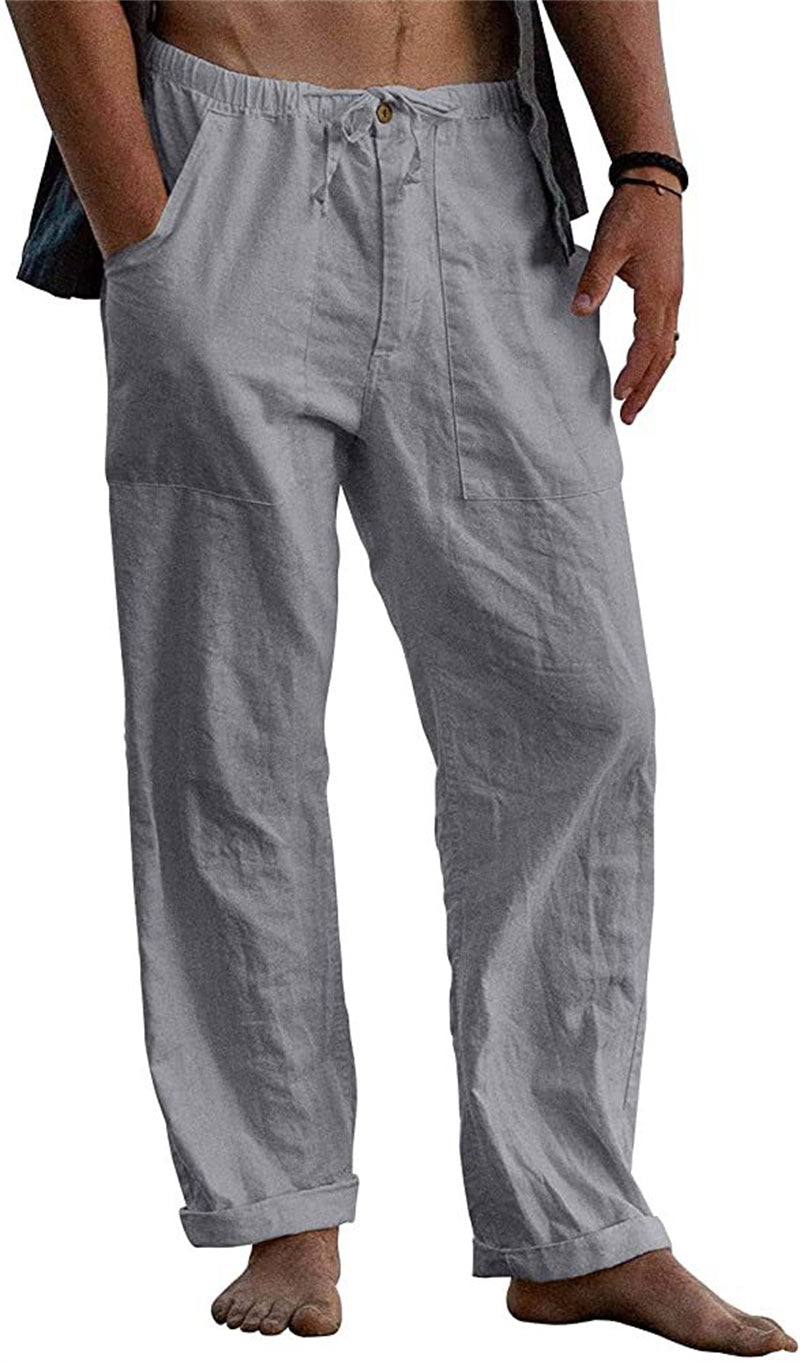 Person wearing light gray pants on a white background