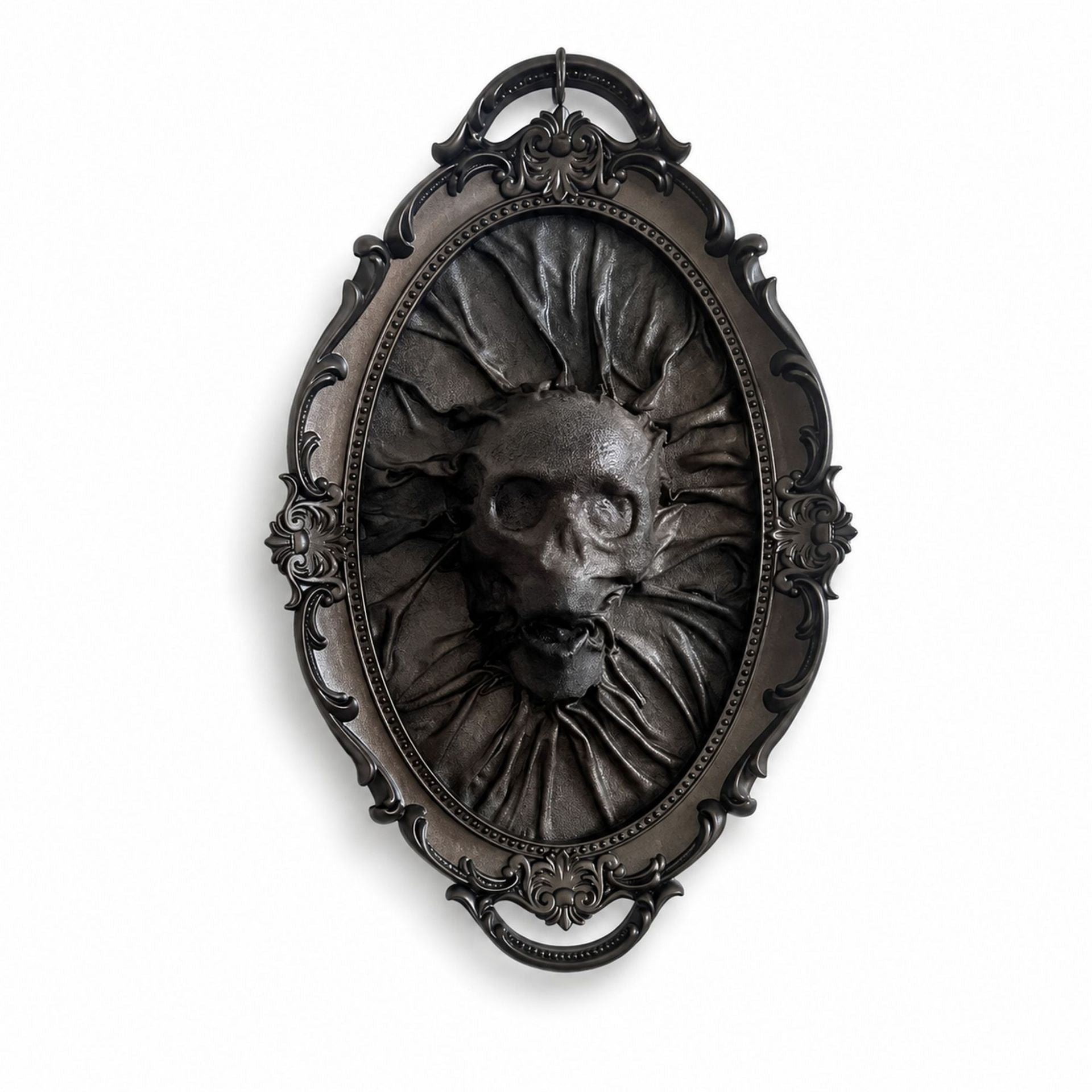 An ornate oval gothic wall plaque featuring a dark metallic relief sculpture of a skull with sunburst rays and a ruffled collar, set against a plain white background.