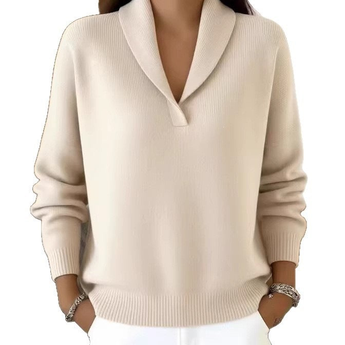 Beige sweater worn by a person on a white background