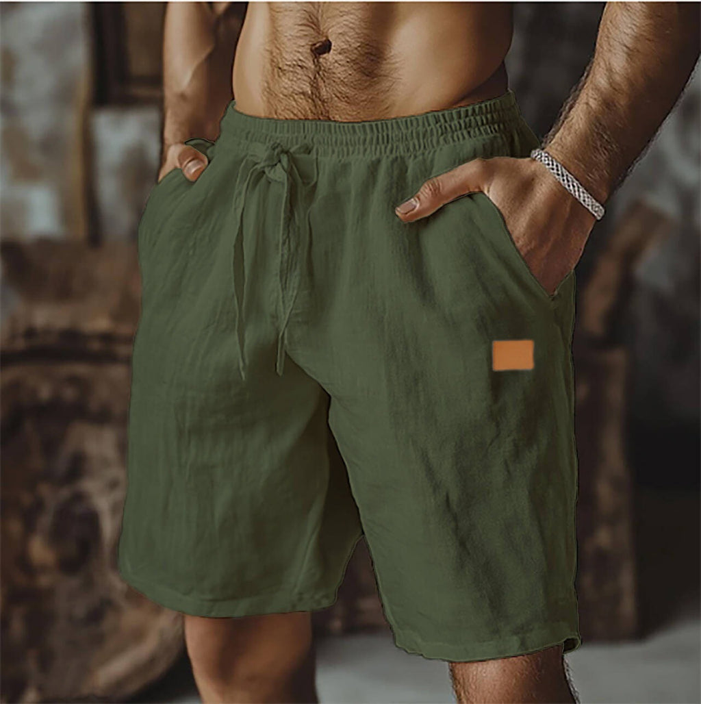 Green shorts worn by a person with a blurred background