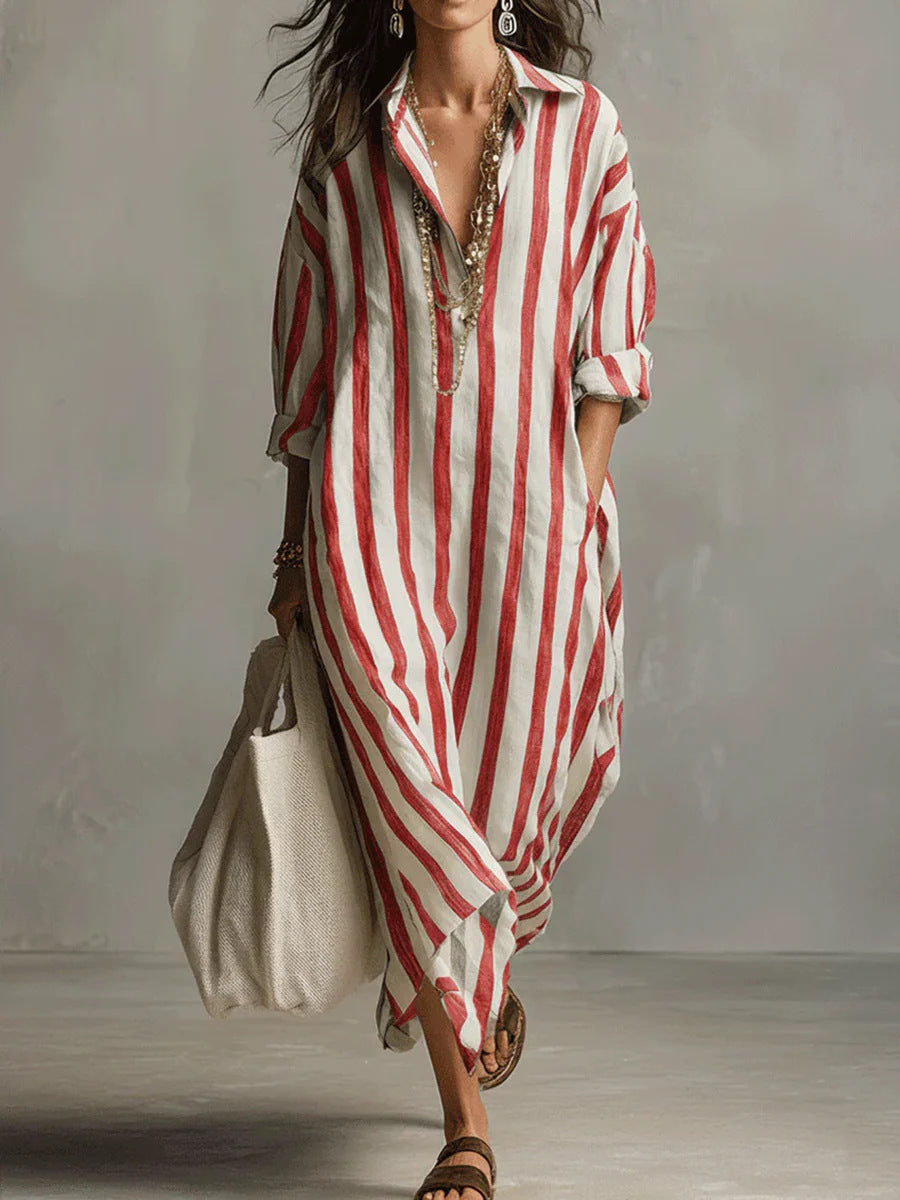 Woman wearing a red and white striped dress with a plain background