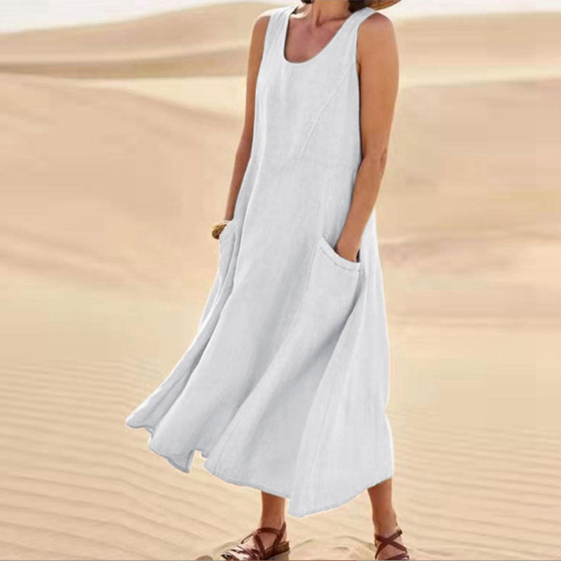 Person wearing a light blue sleeveless dress in a desert setting