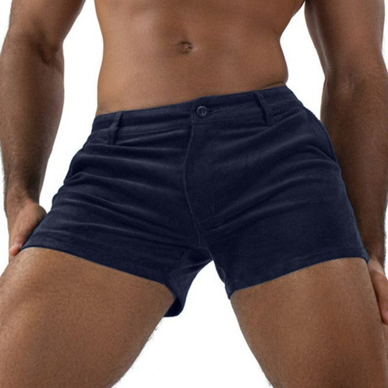 Navy blue boxer briefs worn by a person on a white background
