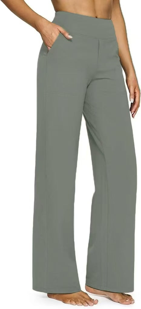 Woman wearing gray wide-leg pants with a neutral background