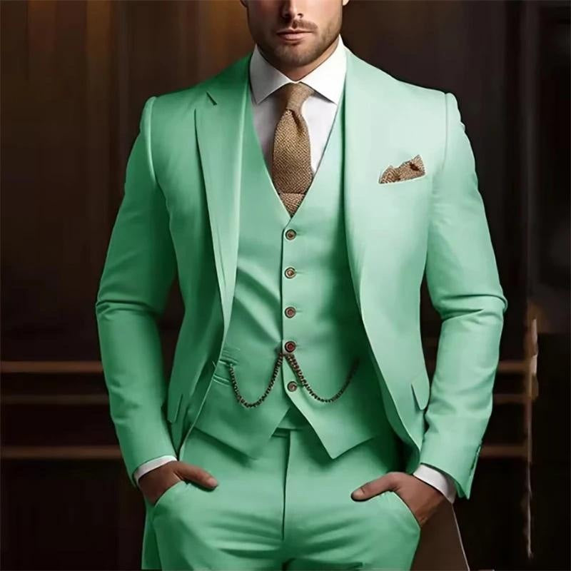 Mint green suit with a white shirt and patterned tie on a dark background