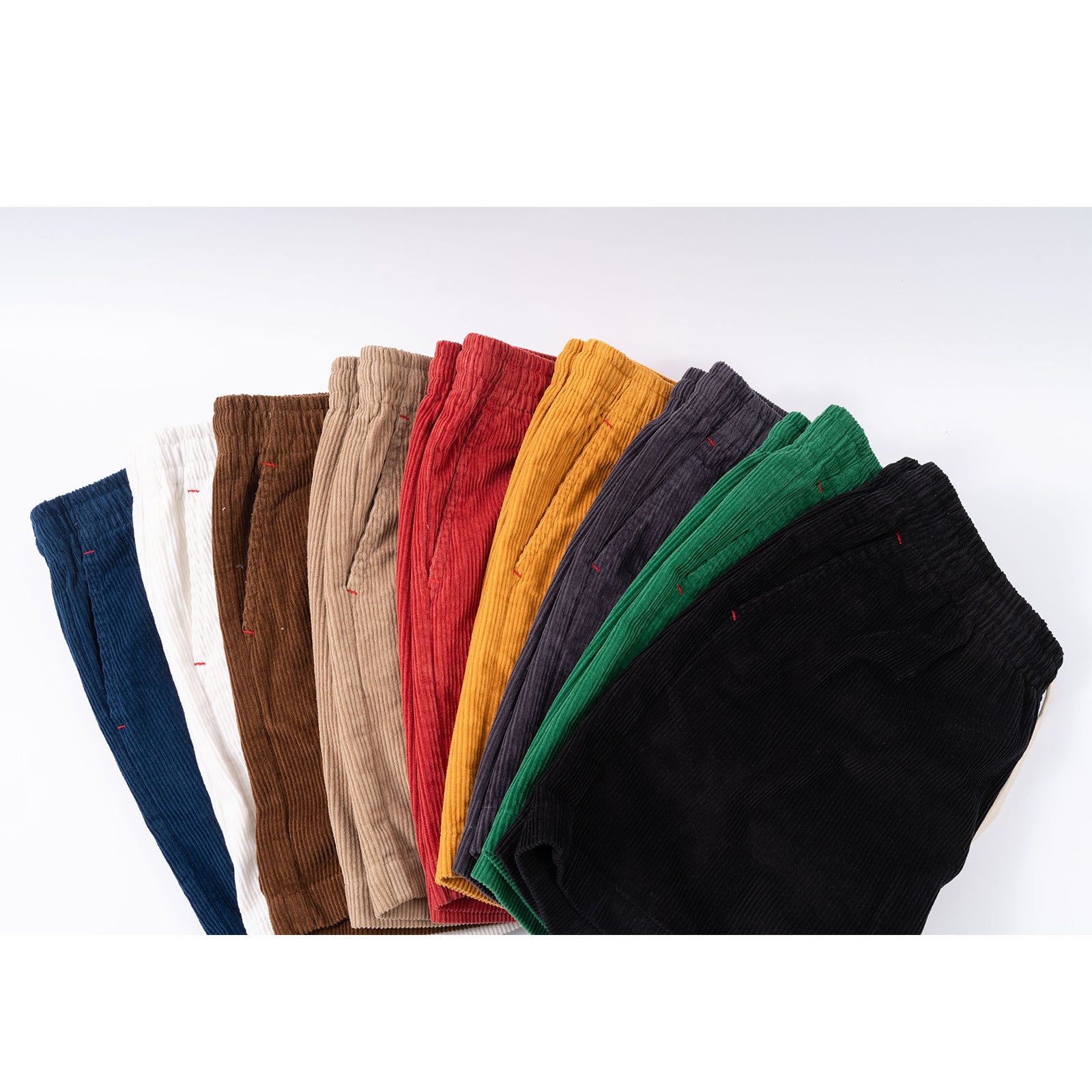 Set of colorful tights arranged in a row on a white background