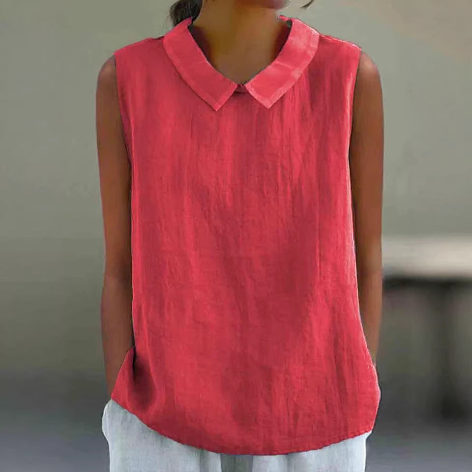Person wearing a red sleeveless shirt with a collar against a neutral background