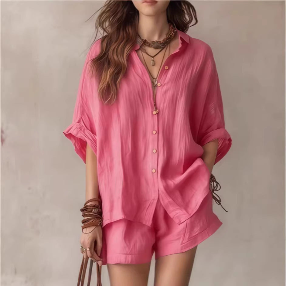 Woman wearing a pink outfit with a plain background