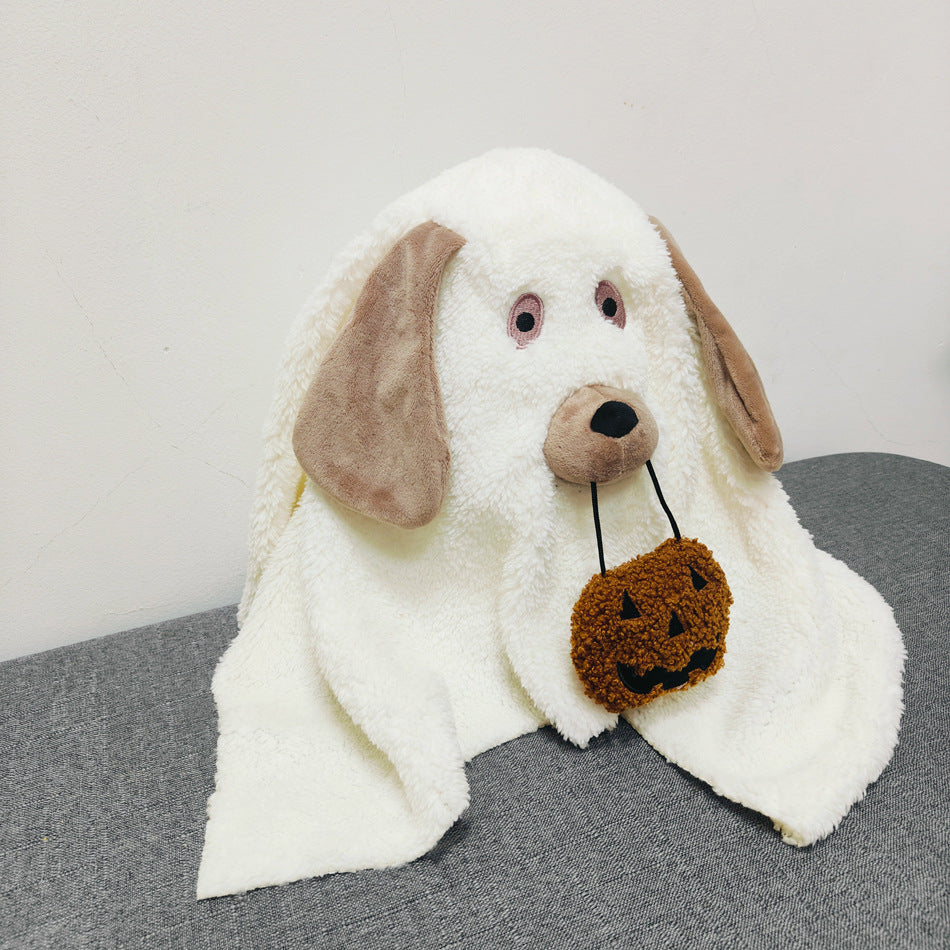White plush dog toy with brown ears and a brown tag on a gray surface.