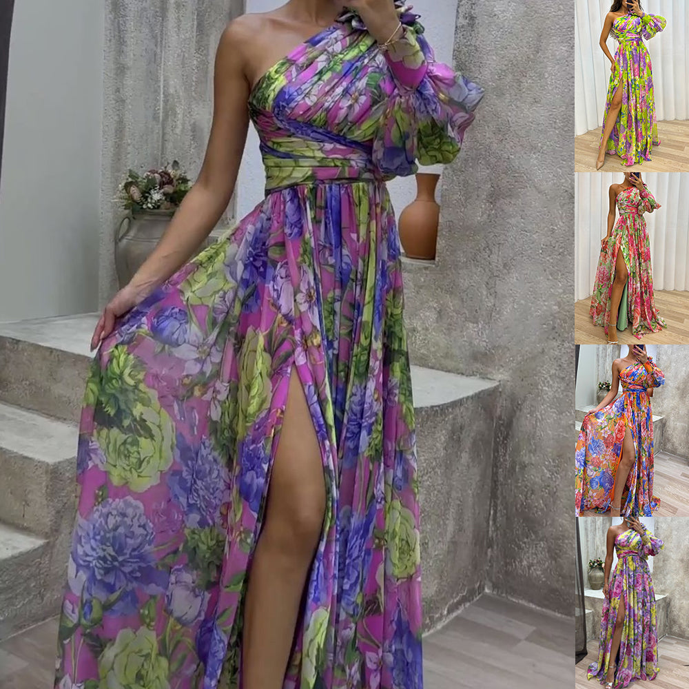 Woman wearing a colorful floral dress with a slit, standing on stairs.