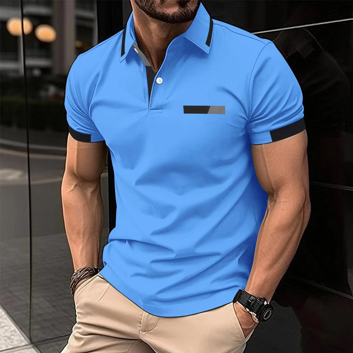 Man wearing a blue polo shirt with black accents in an urban setting