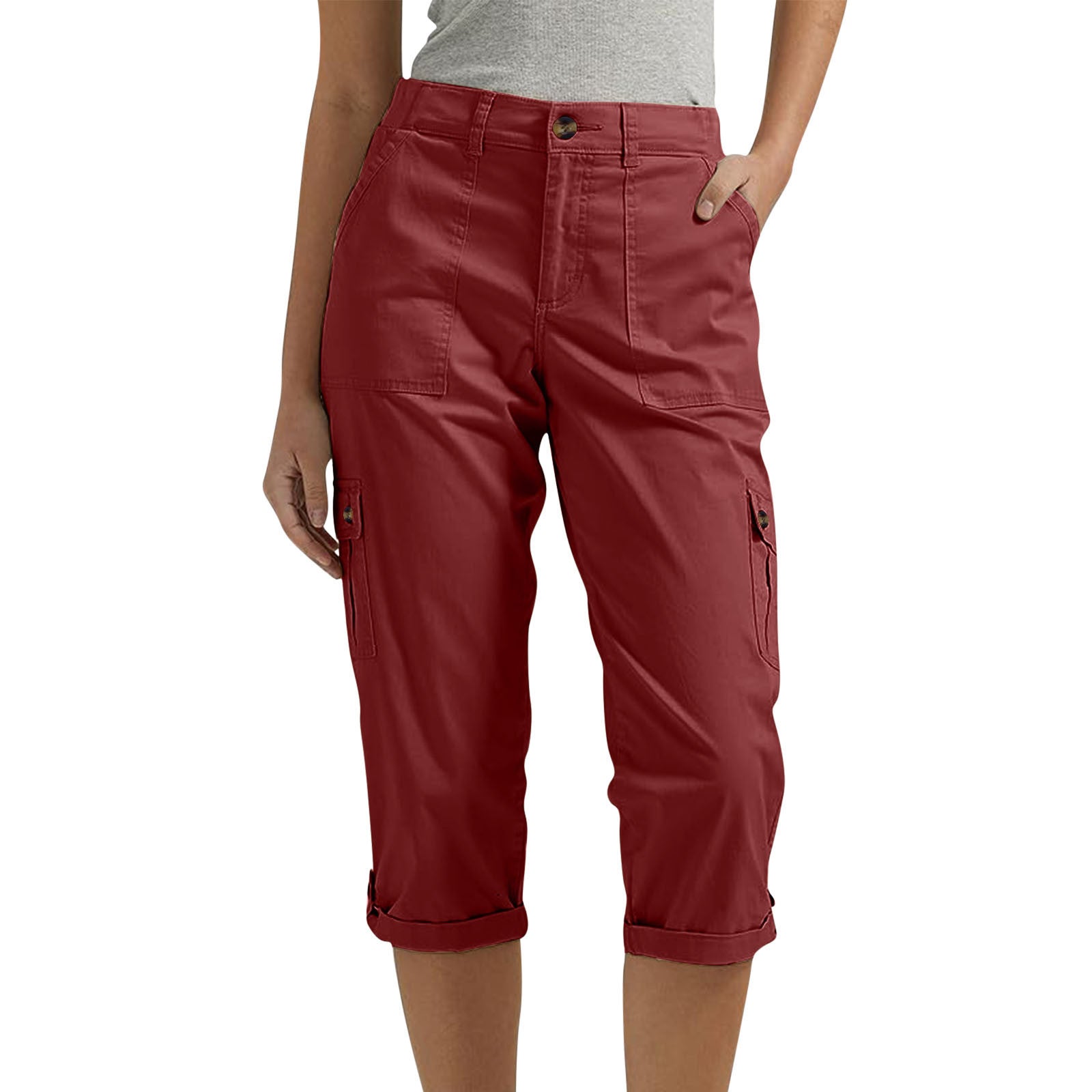 Red capri pants worn by a person on a white background