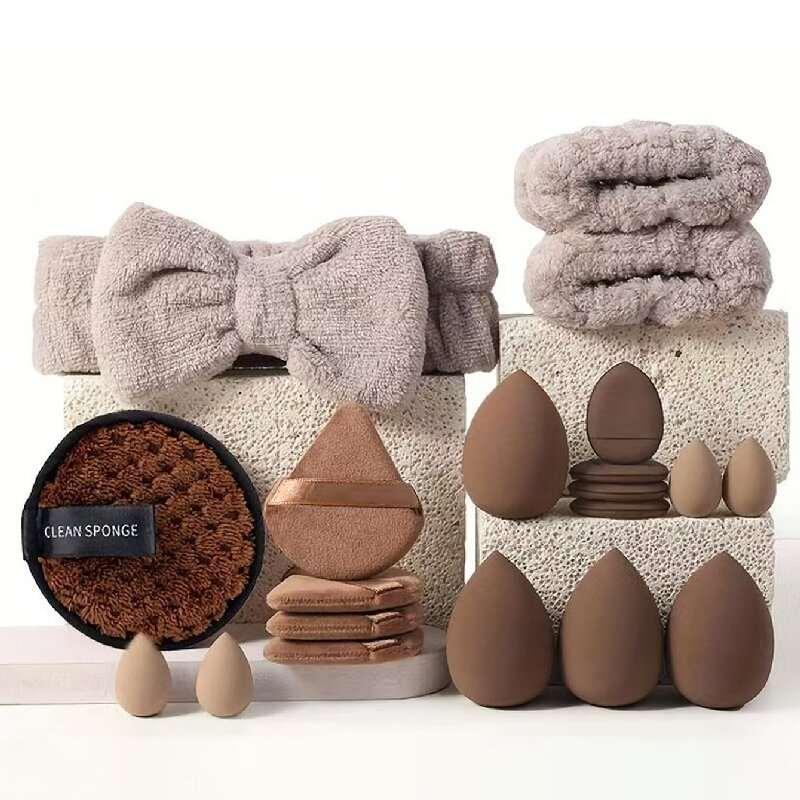 Assorted makeup sponges, cleansing pads, and soft headbands in neutral colors, displayed neatly.