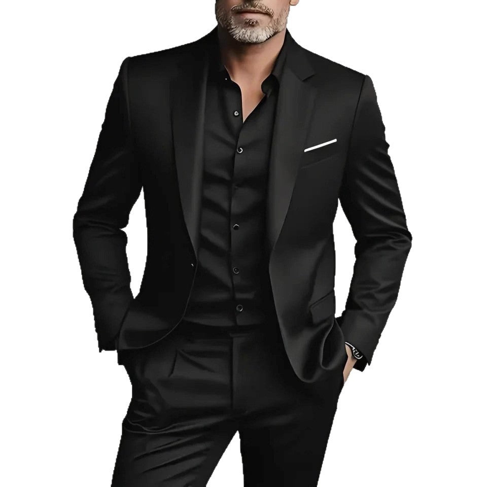 Man wearing a black suit with a white pocket square on a white background