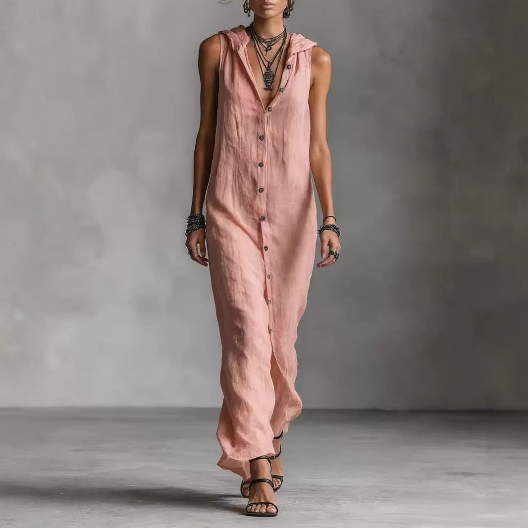 Person wearing a long pink dress against a gray background