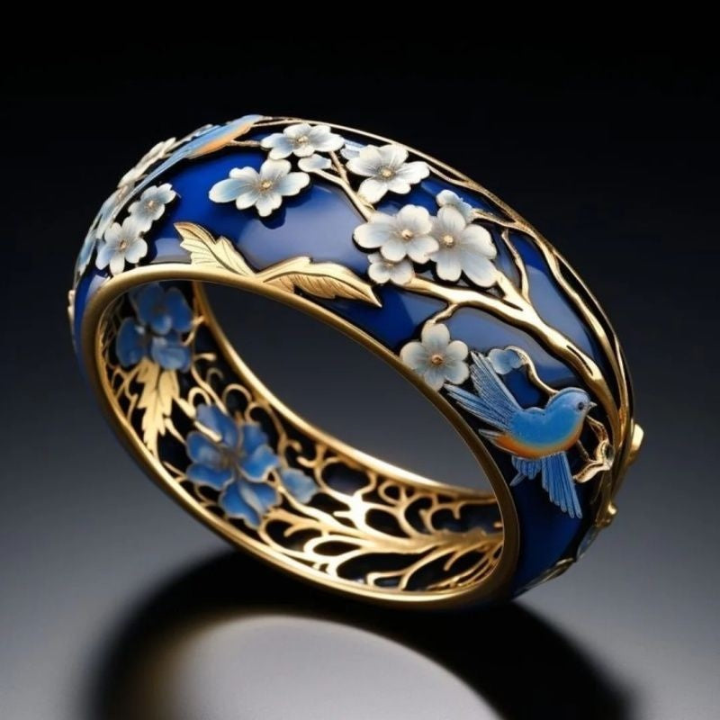 Decorative bracelet with floral patterns and a bird on a dark background