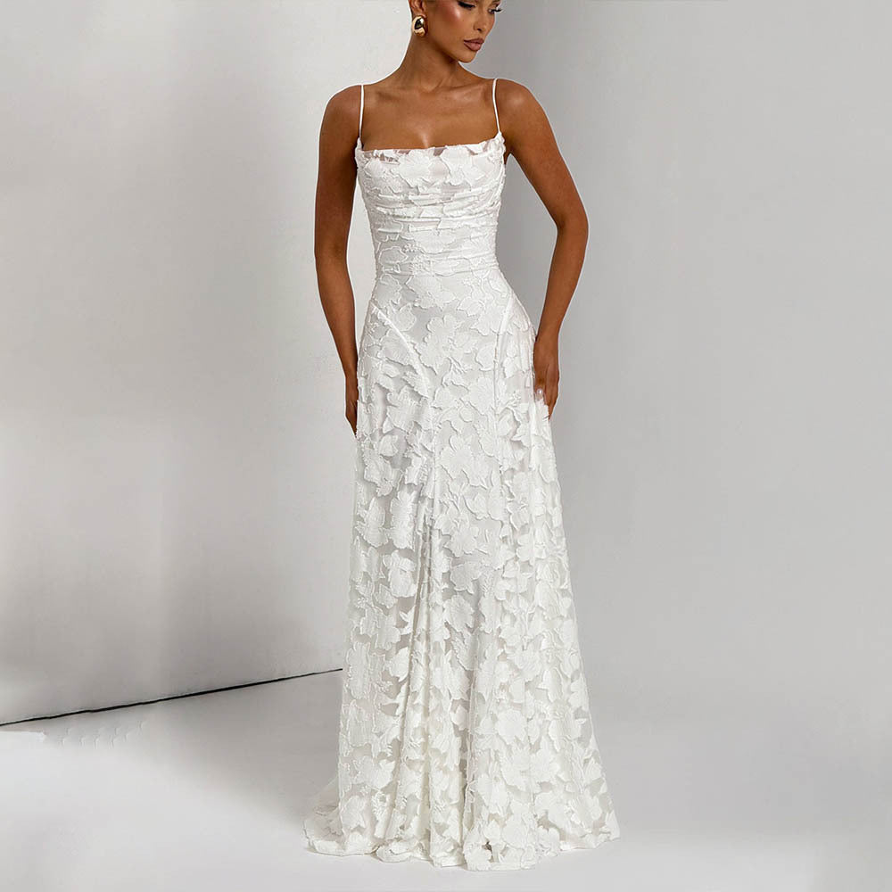 White lace dress on a model against a plain background