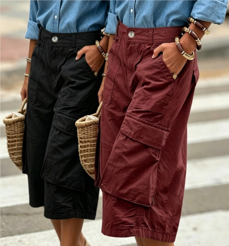 Two people wearing shorts with a blurred background