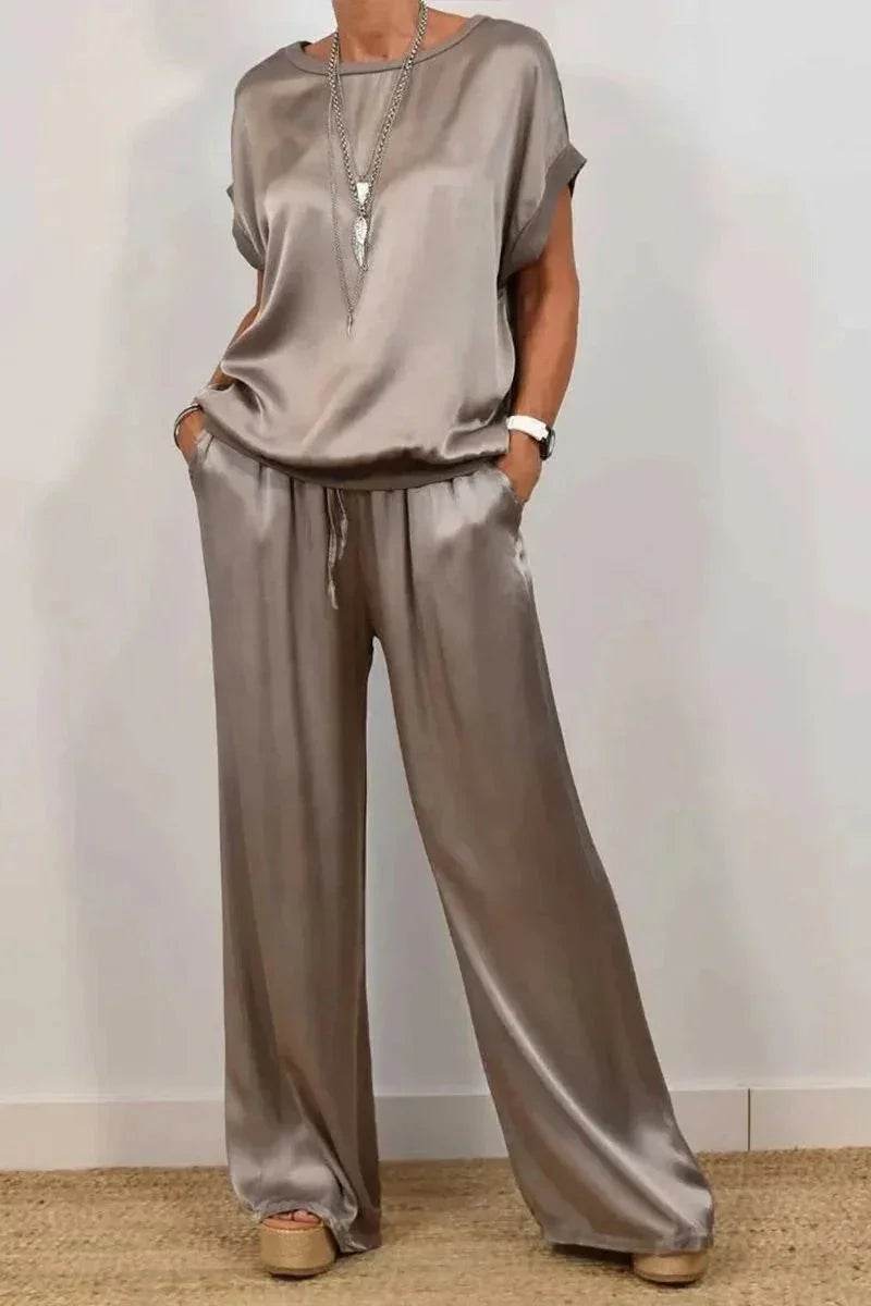 Woman wearing a chic taupe satin lounge set with wide-leg pants from ZA-Zola fashion UK