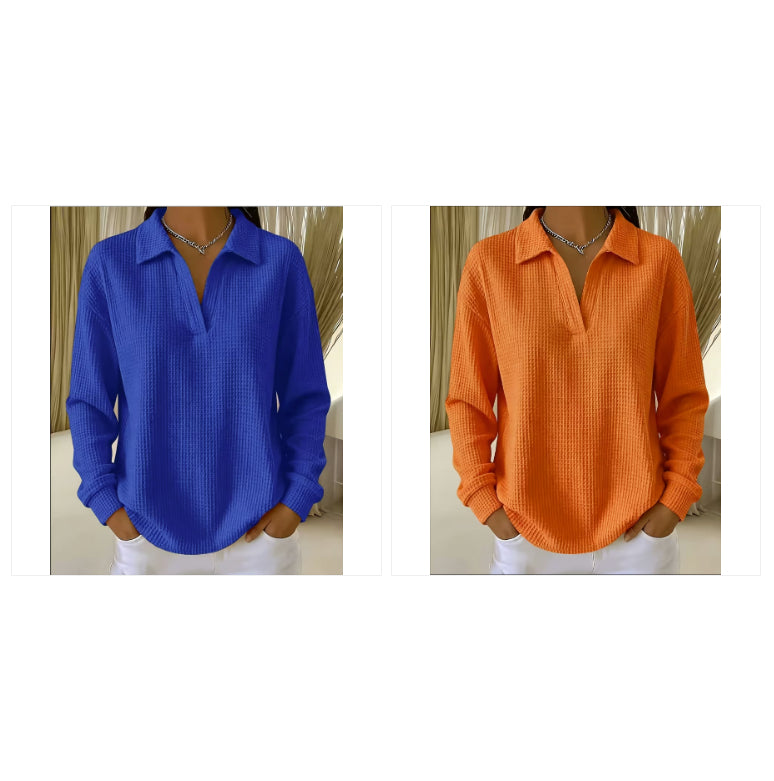 Two women's long-sleeve collared button-front tops shown side by side, one in royal blue and one in bright orange, both worn with white bottoms and layered necklaces.