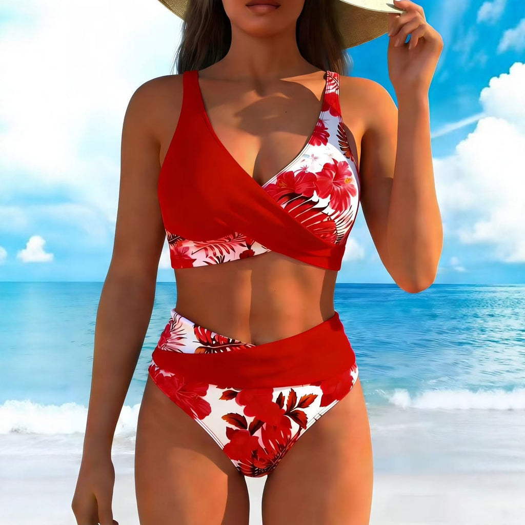 Woman wearing a red and white floral bikini set on a beach.