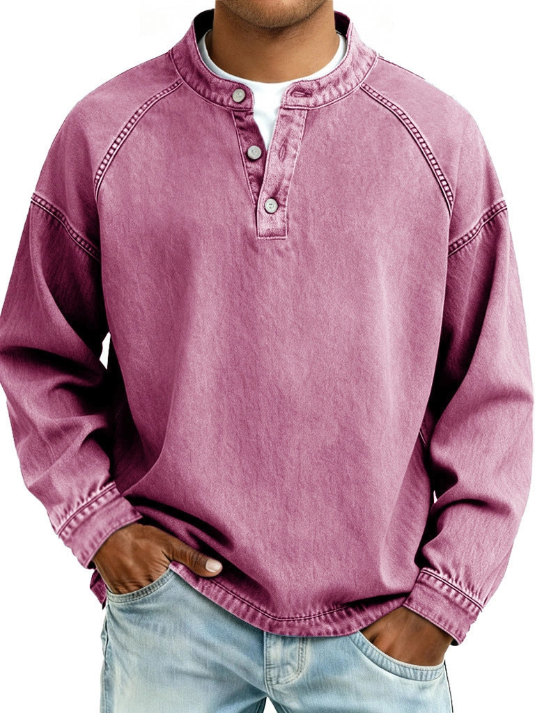Person wearing a pink long-sleeve shirt with button details on a white background