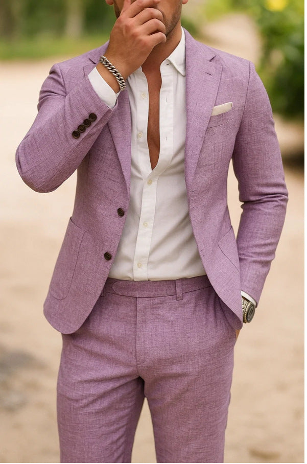 Man wearing a light purple suit with a white shirt outdoors.