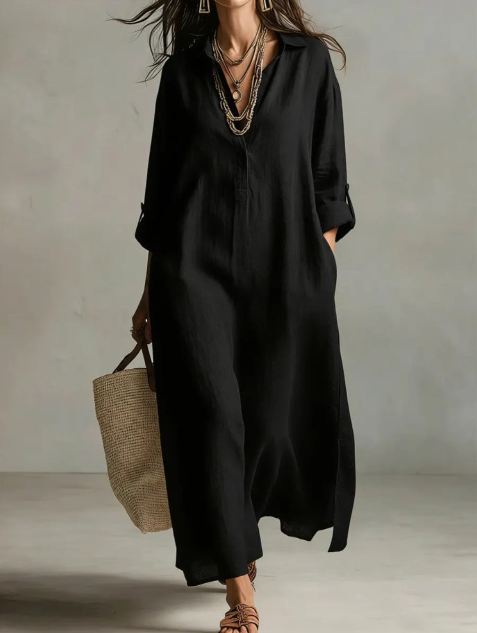 Person wearing a black dress holding a woven bag against a neutral background