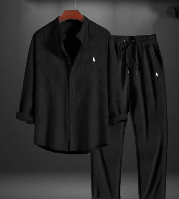 Black shirt and pants set with a logo on a gray background