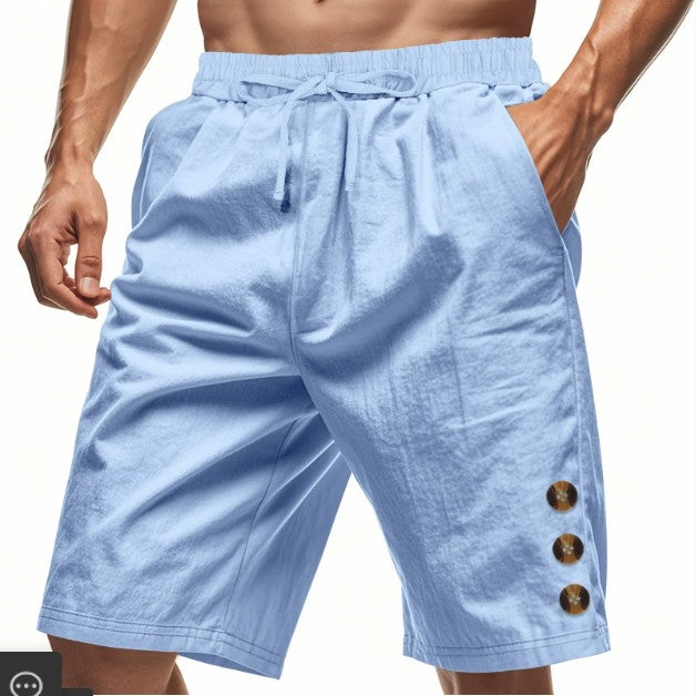Light blue shorts with button details on a white background