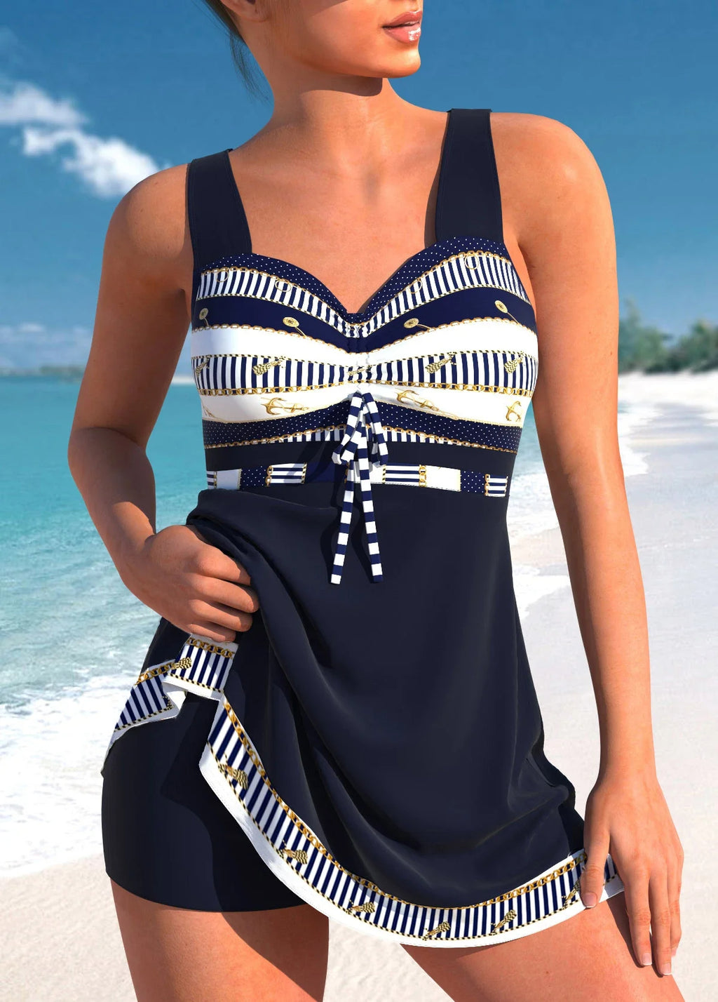 Woman wearing a navy blue and white patterned swimsuit on a beach.