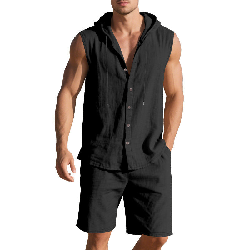 Man wearing a black sleeveless shirt with a hood and shorts on a white background