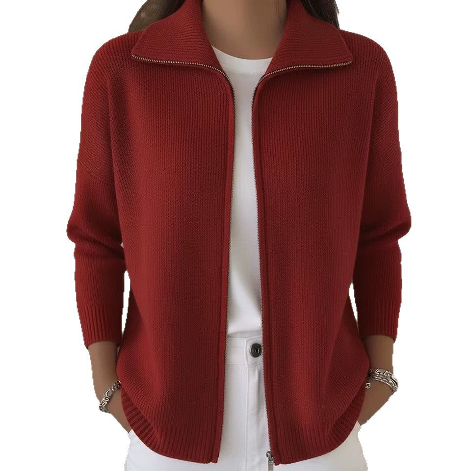 Red ribbed sweater worn by a person on a white background