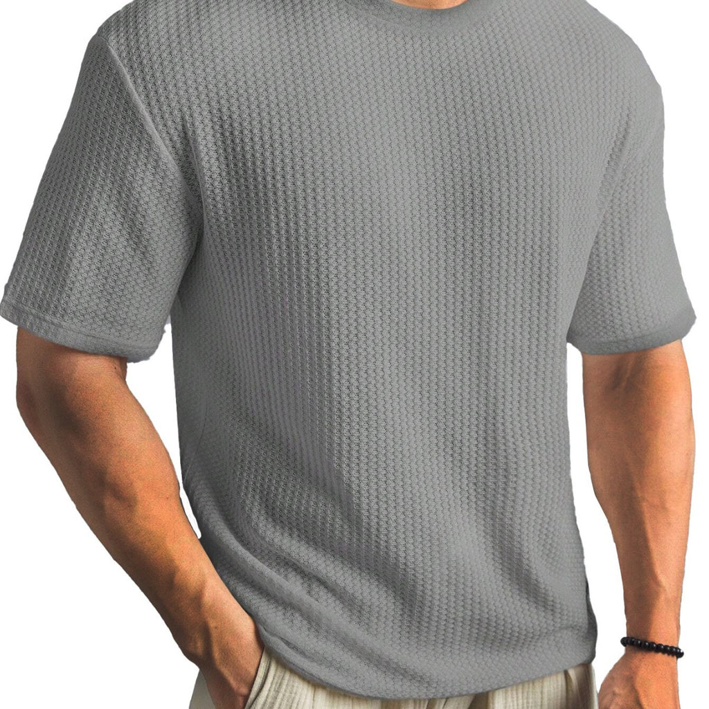 Person wearing a textured gray t-shirt on a white background
